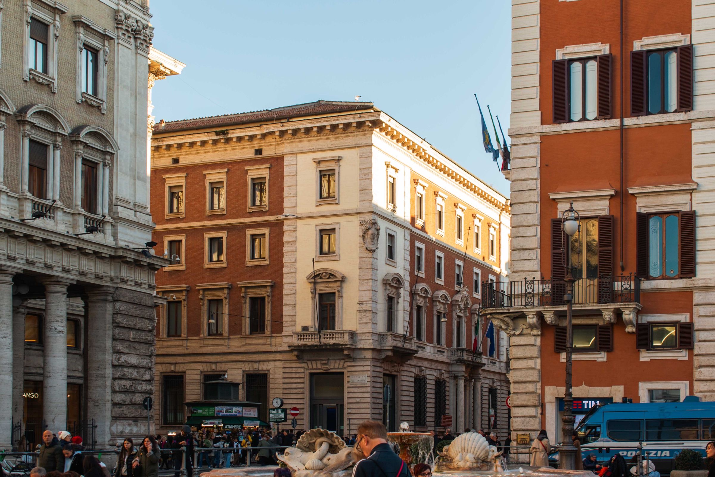 A business traveller on a Rome street in the morning light